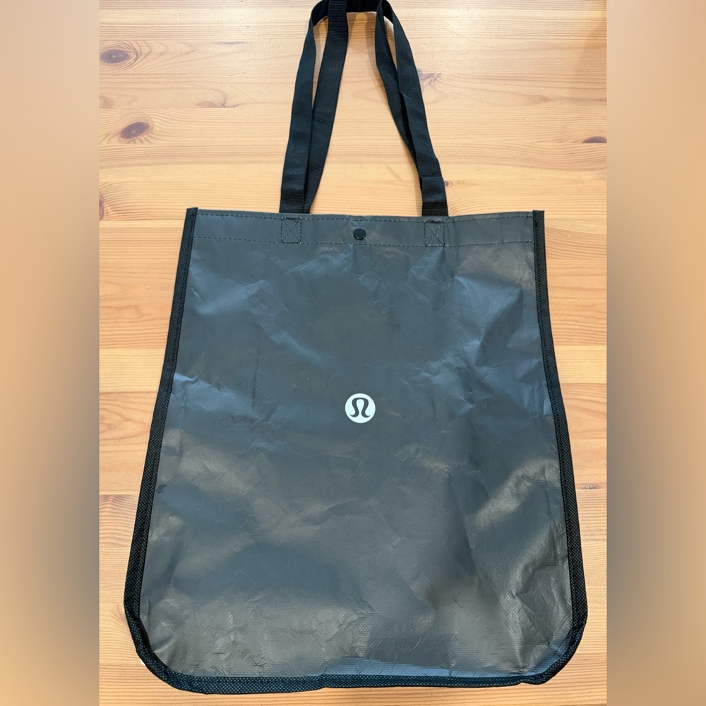 lululemon Black and White Tote Bag with Snap Closure